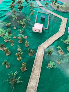 A picture containing sitting, green, table, old Description automatically generated