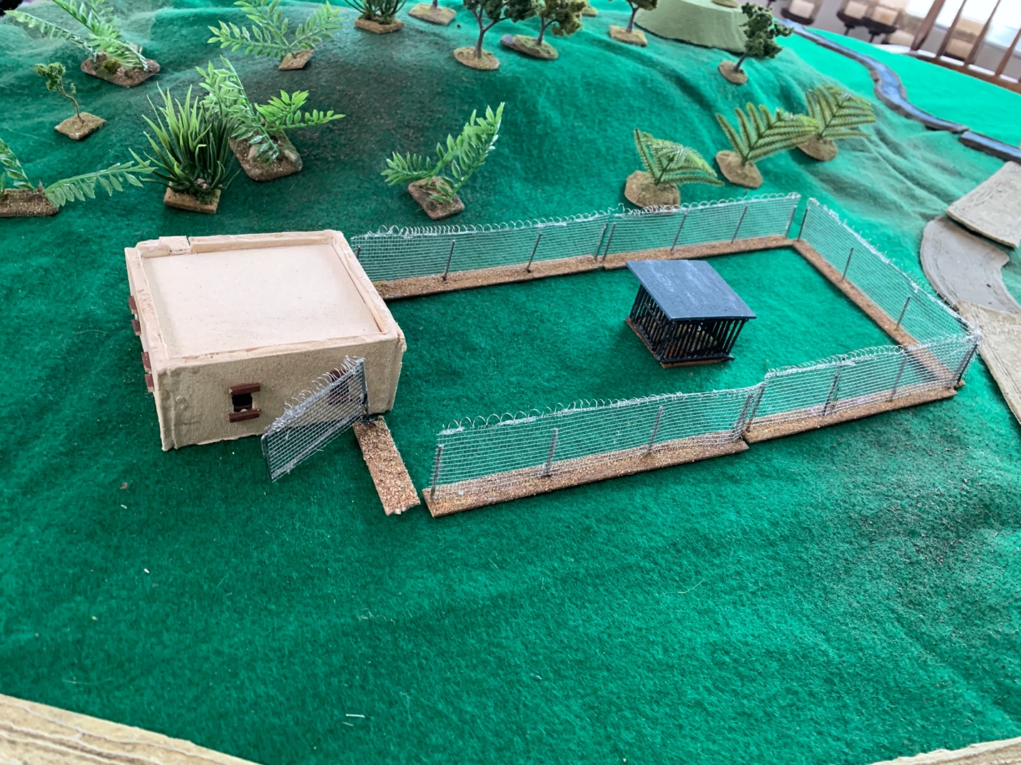 A picture containing table, green, sitting, water

Description automatically generated